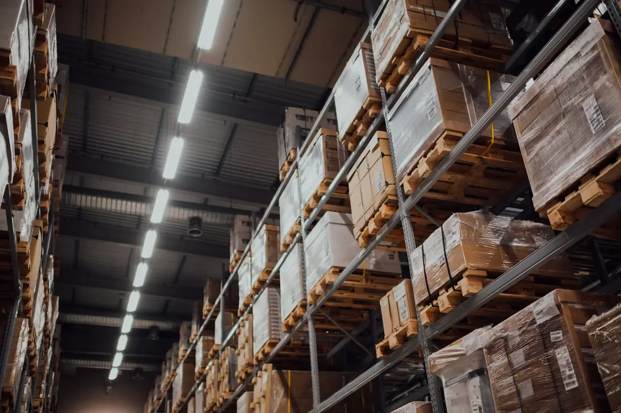 Tall warehouse racking with labeled boxes